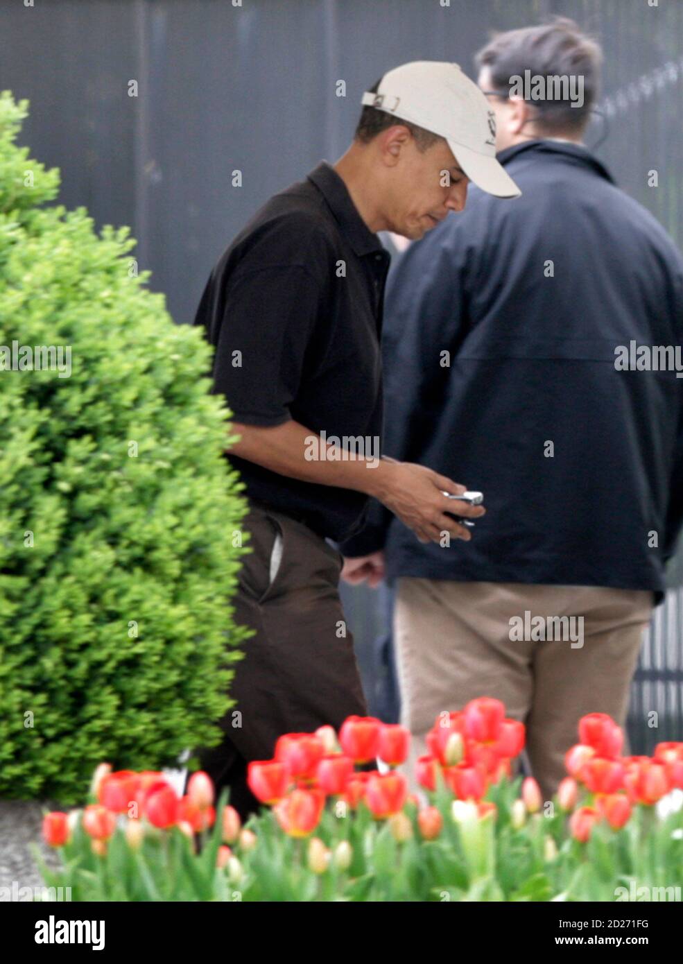 U.S. President Barack Obama returns to the White House in Washington after playing golf at Fort Belvoir, Virginia April 3, 2010. REUTERS/Yuri Gripas (UNITED STATES - Tags: POLITICS) BEST QUALITY AVAILABLE Stock Photo
