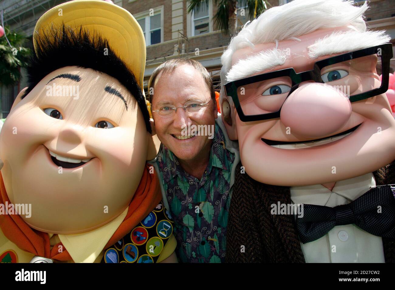 John Lasseter (C), chief creative officer at Pixar and Walt Disney  Animation Studios and executive producer of 