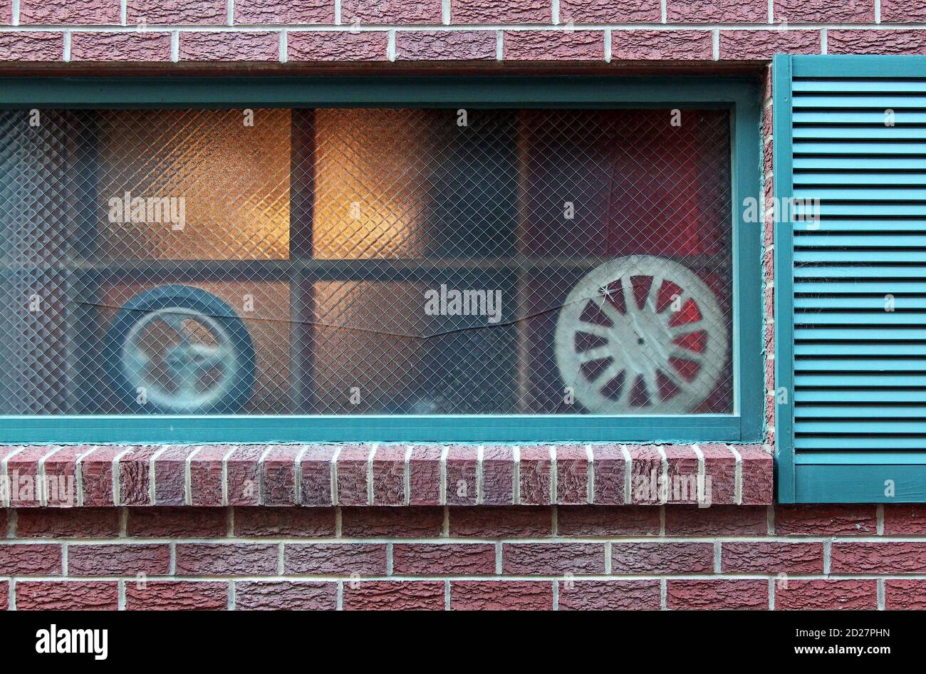 A couple of wheels in a window. Stock Photo