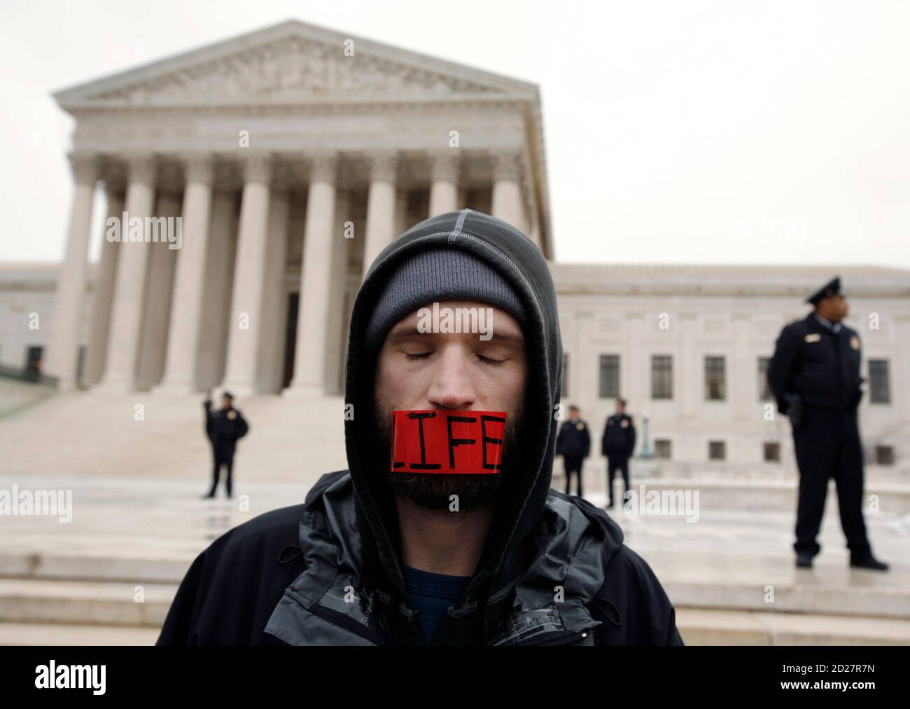 A pro-life demonstrator stands in front of the U.S. Supreme Court building during the 'March for Life', marking the 35th anniversary of the Supreme Court's 1973 decision in Roe vs Wade that made abortion legal, in Washington January 22, 2008.    REUTERS/Kevin Lamarque   (UNITED STATES) Stock Photo