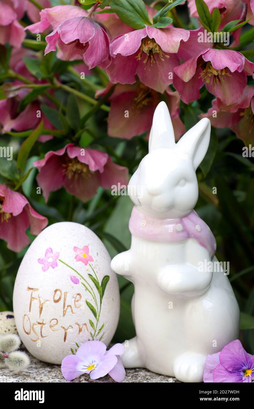 easter decoration with easter bunny, easter egg and helleborus orientalis flowers Stock Photo