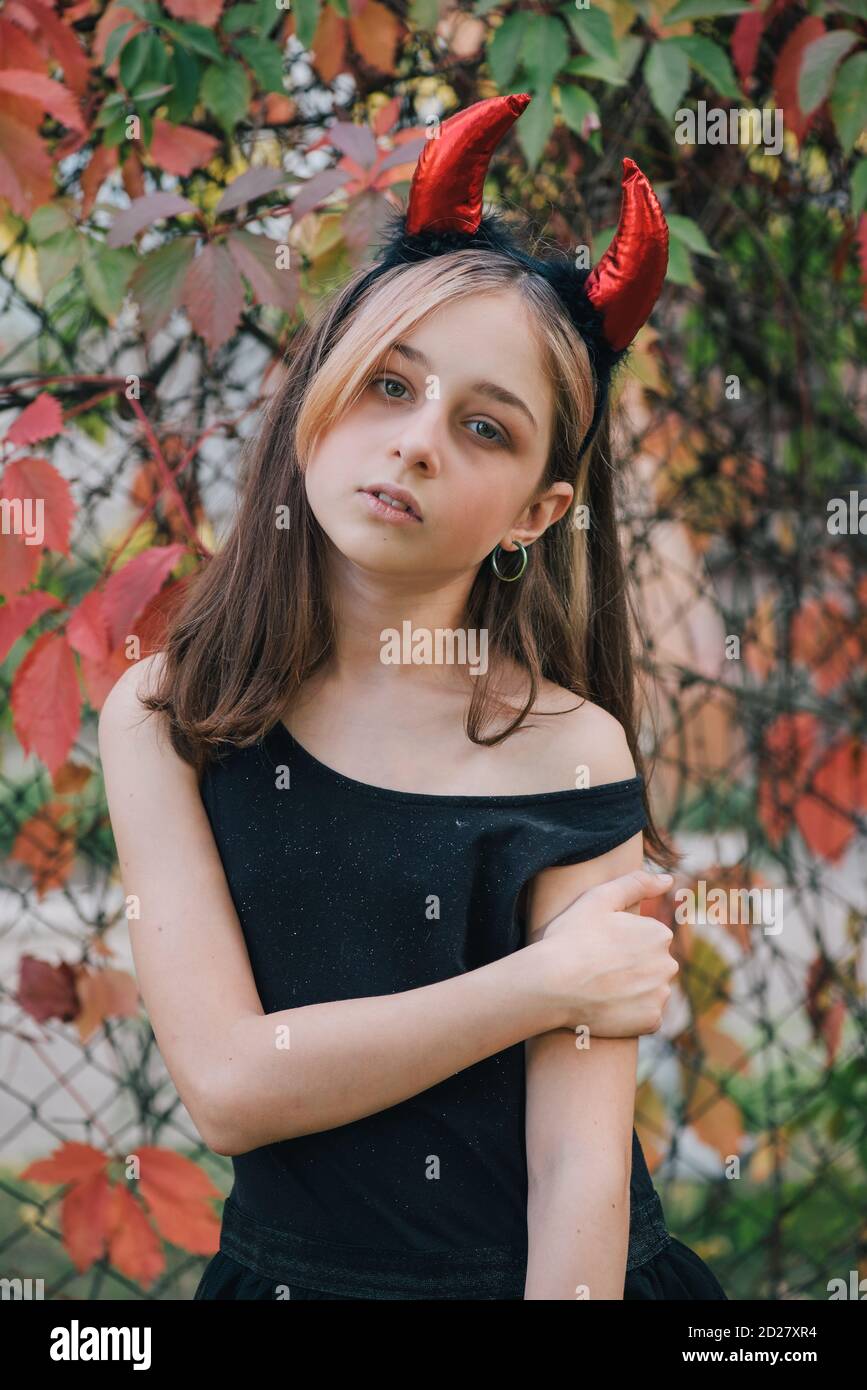 little girl in costumes for Halloween celebration. Halloween party