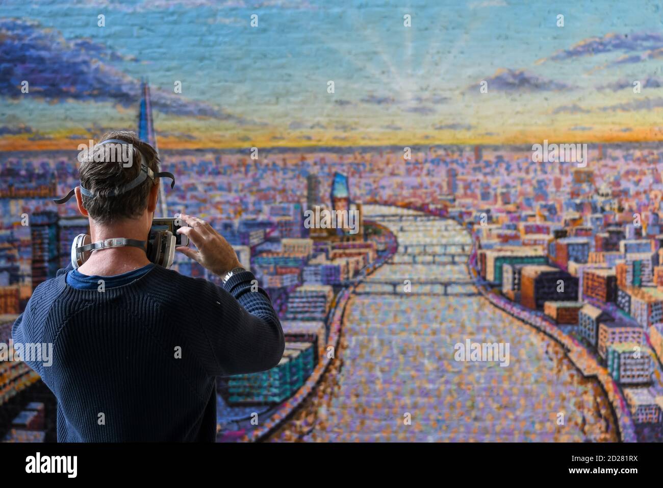 London cityscape mural by Jimmy C an artist supported by Network Rail. The piece emphasises the life, light and energy of London. This mural can be seen at Blackfriars station near the Thames. Stock Photo