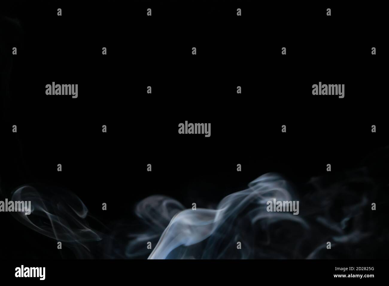 Abstract smoke background with copy space on black background. Blue ...