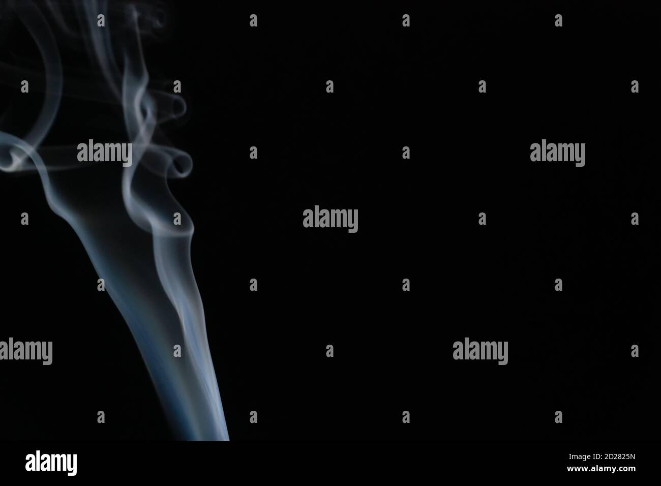 Abstract smoke background with copy space on black background. Blue ...