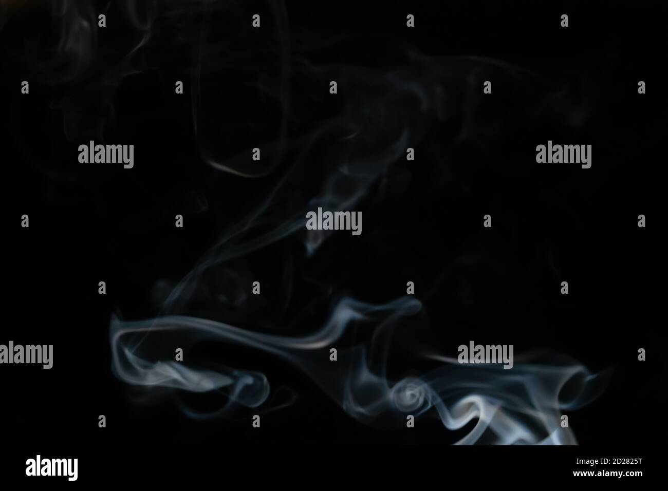Abstract smoke background with copy space on black background. Blue ...