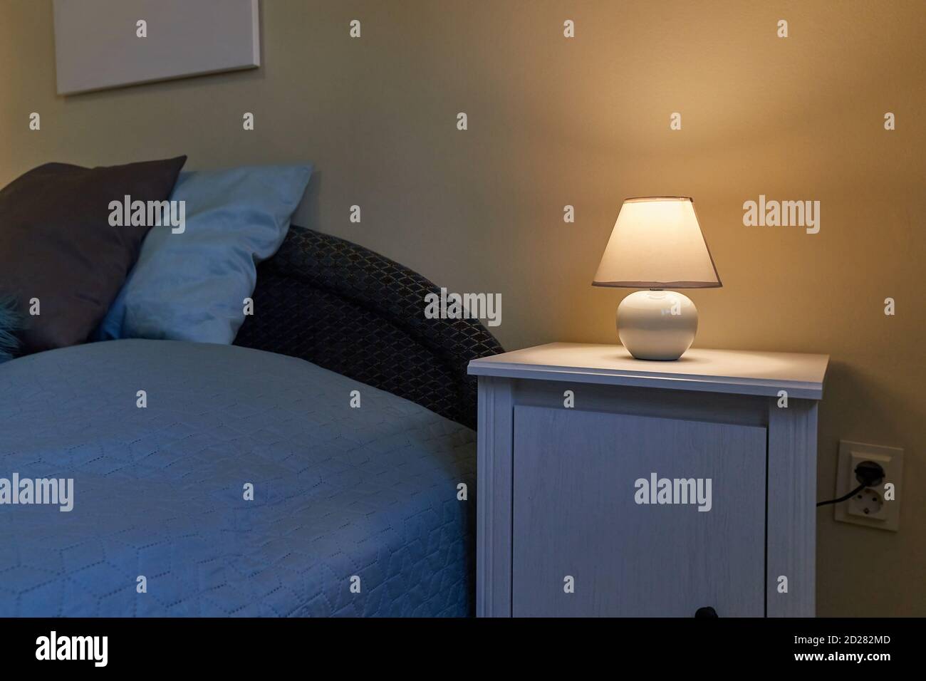 Lamp on a nightstand Stock Photo Alamy