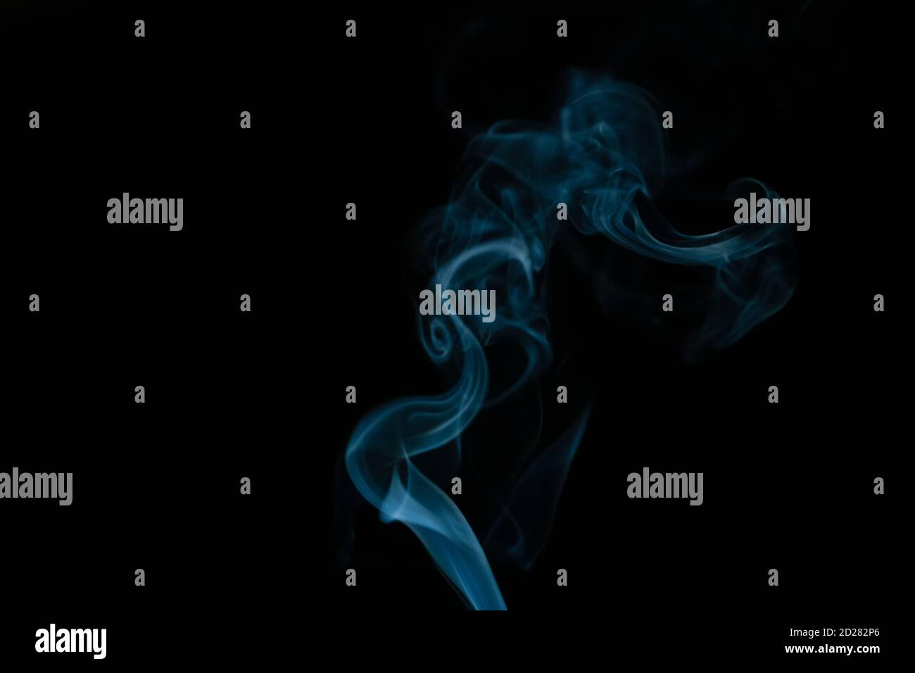Beautiful abstract blue smoke with copy space on black background ...