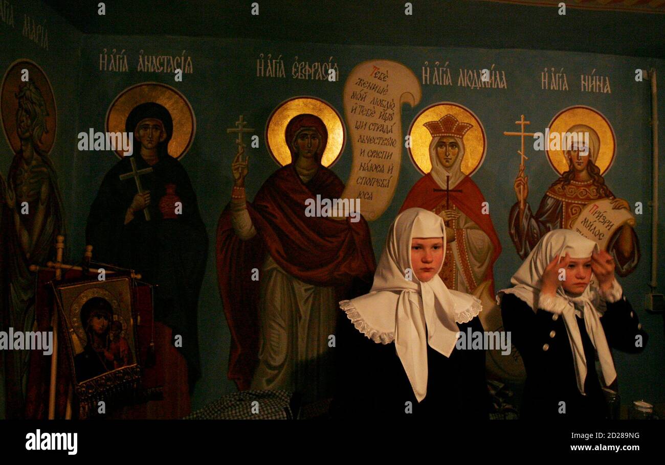 Young conventuals of Saint-Nickolas nunnery attend an Orthodox Easter mass in the town of Maloyaroslavets, some 130 km (81 miles) south-west of Moscow early April, 27 2008. REUTERS/Denis Sinyakov   (RUSSIA) Stock Photo