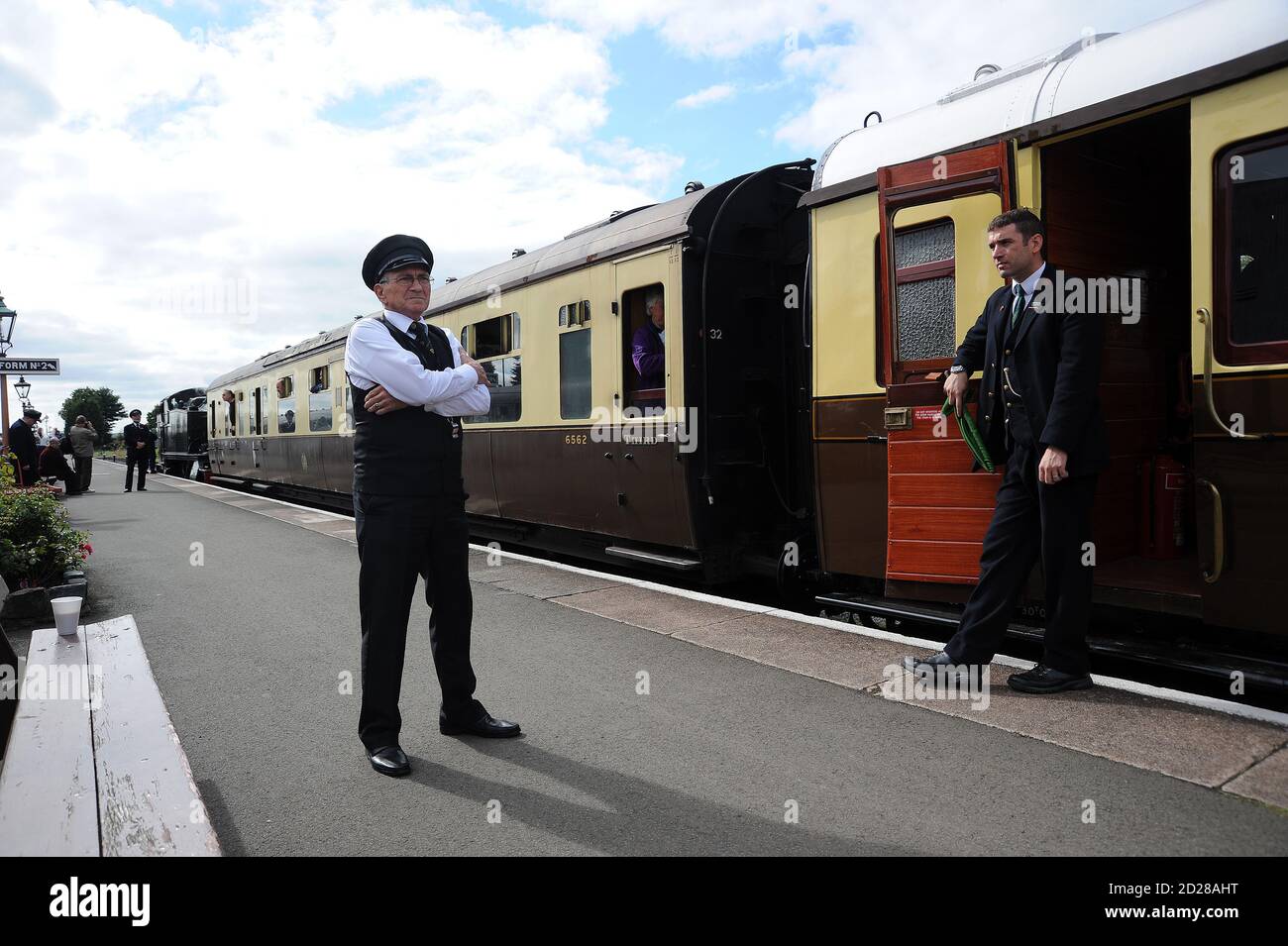 Train guard and station staff get ready for the departure of "5164