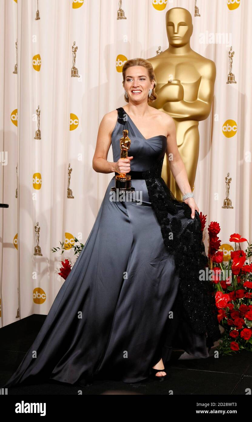 Tangle efterskrift tage medicin Kate Winslet holds her best actress Oscar for 'The Reader" backstage at the  81st Academy Awards in Hollywood, California, February 22, 2009.Winslet is  dressed in a tulle dress by Atelier Yves Saint