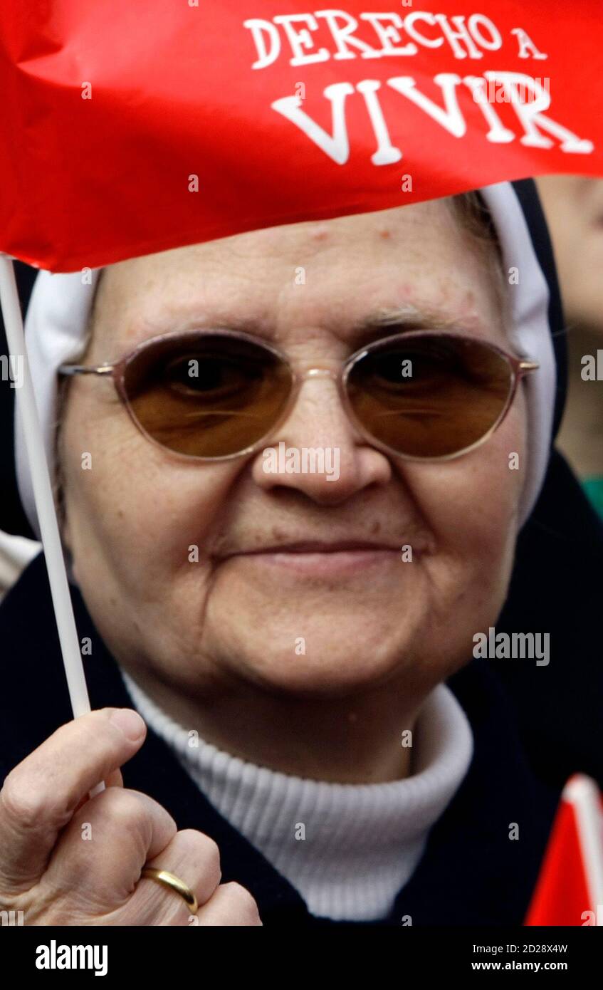 A Catholic Nun Holds A Flag As She Takes Part In An Anti Abortion Protest Called By Several Spanish Pro Life Groups In Central Madrid March 29 09 The Flag Reads Right To Life