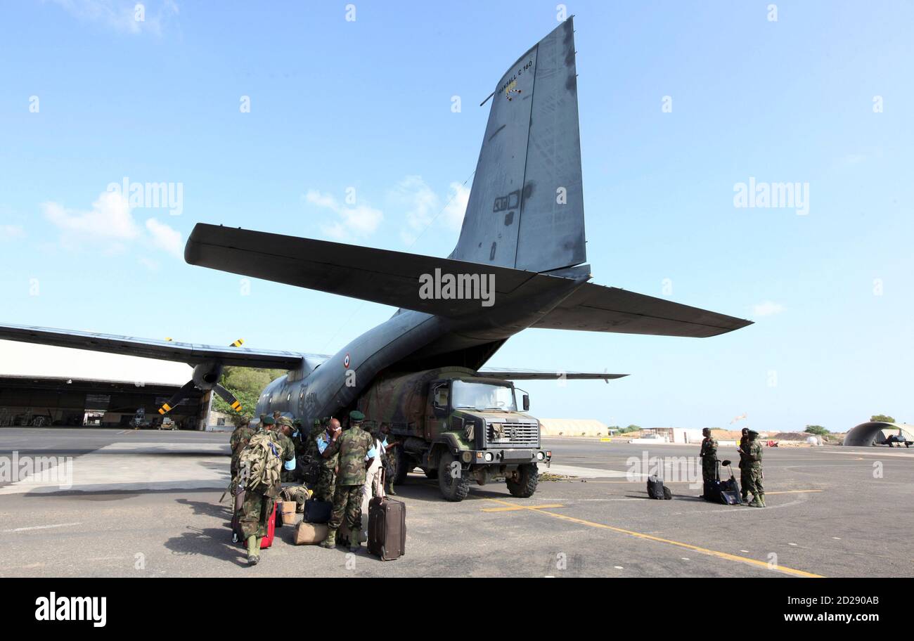 Members of the Eastern Africa Standby Brigade from Uganda board a French C160 Transall tactical aircraft at the French Air Base 188 in Djibouti, December 5, 2009. The EASB is holding the exercise involving 1,500 troops - from Kenya, Uganda, Rwanda, Ethiopia, Sudan, Burundi, Comoros, Seychelles and Somalia. The aim is to build a proper African peackeeping force which will be able to respond to wars/crises throughout the continent and has the backing of major Western powers as this is the first big exercise they are undertaking. REUTERS/Thomas Mukoya (DJIBOUTI CONFLICT POLITICS MILITARY) Stock Photo