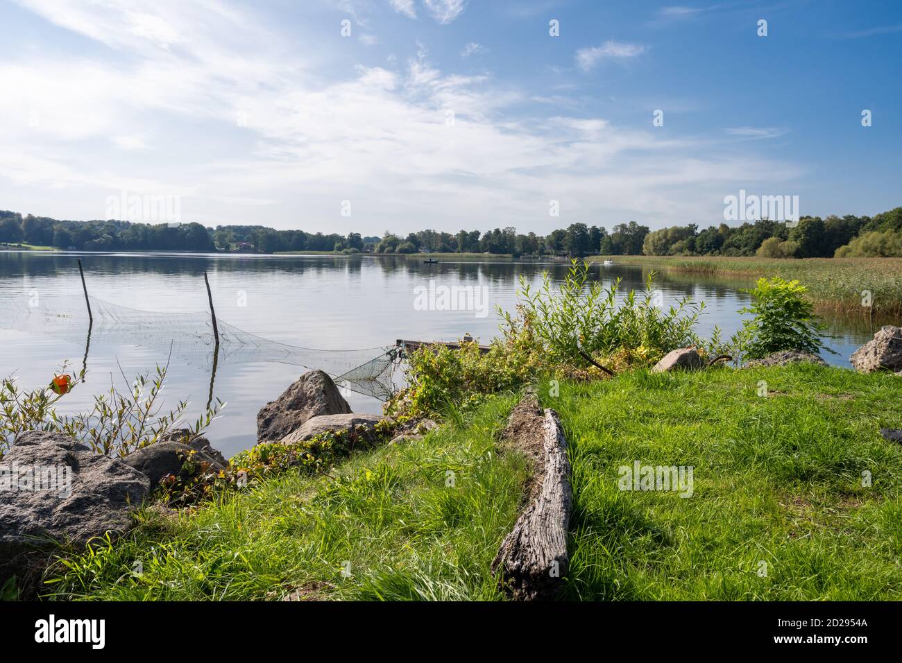 A fishing net in a beautiful lake. Blue sky and water in the background ...