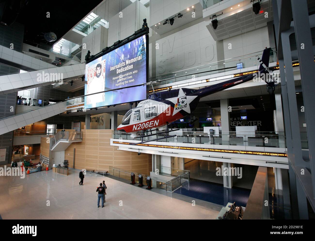 A Bell news helicopter hangs in the atrium of the Newseum, a five-storey building dedicated to the history of news gathering, on Pennsylvania Avenue in northwest Washington April 4, 2008. The $450 million Newseum, which opens to the public on April 11, features 14 high-tech interactive exhibits exploring news history, electronic news, photojournalism, coverage of the September 11, 2001 attacks and a memorial to the over 1,800 journalists from around the world who died or were killed in the pursuit of news globally over the decades. REUTERS/Jason Reed (UNITED STATES) Stock Photo