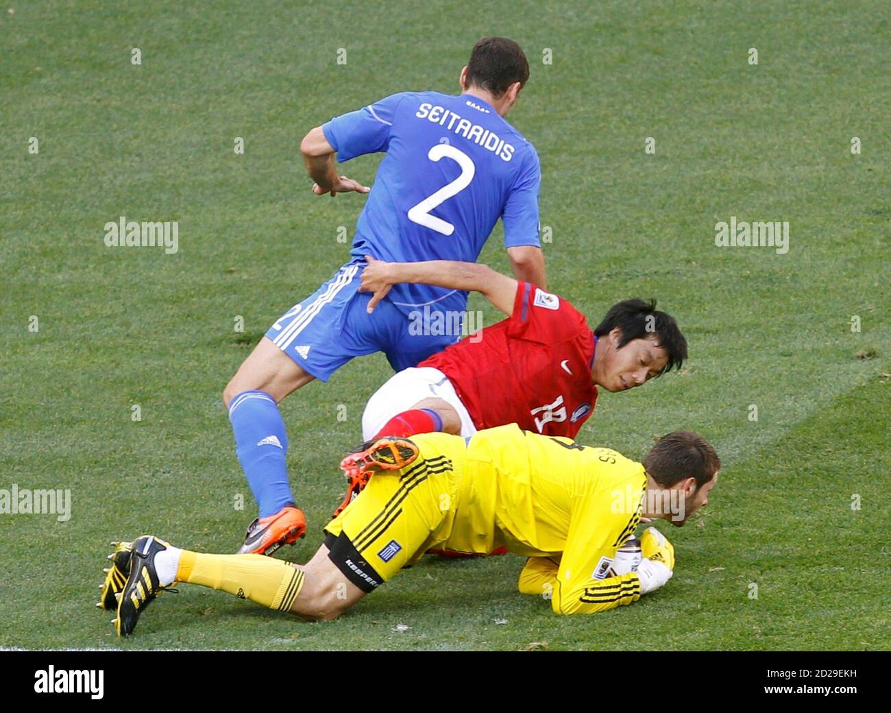 South Korea S Yeom Ki Hun C Fights For The Ball Against Greece S Giourkas Seitaridis Top And Goalkeeper Alexandros Tzorvas During The 10 World Cup Group B Soccer Match At In Port Elizabeth June