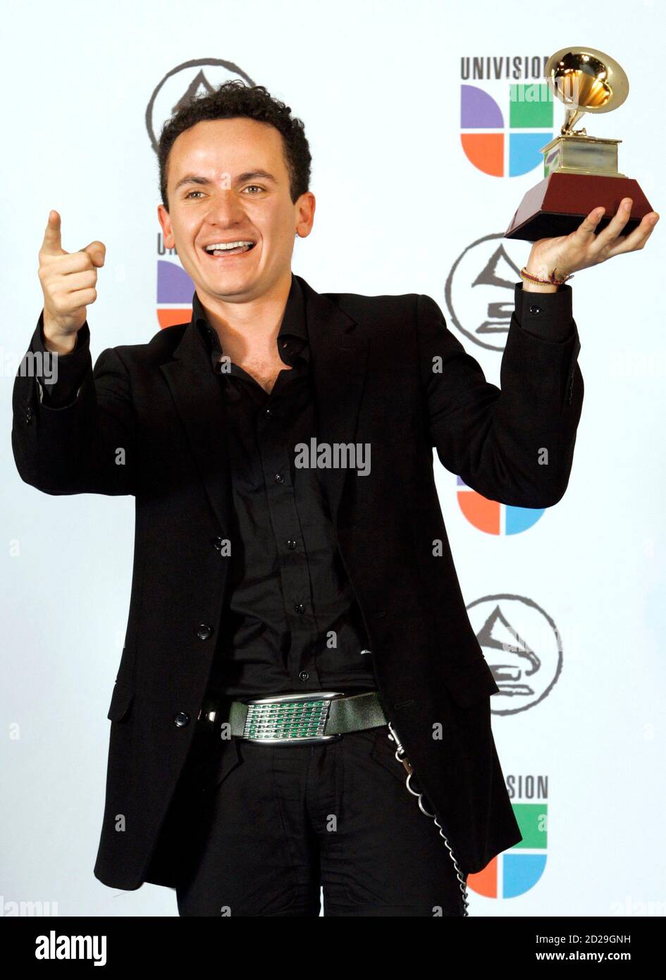 Juan Fernando Fonseca holds his award for Best Tropical Song for 