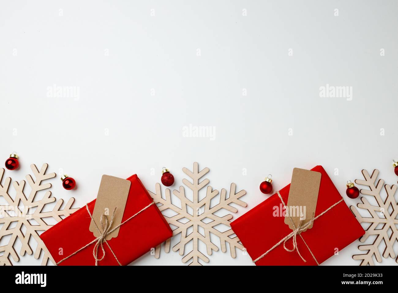 Red gift boxes and Christmas baubles on white background Stock Photo ...
