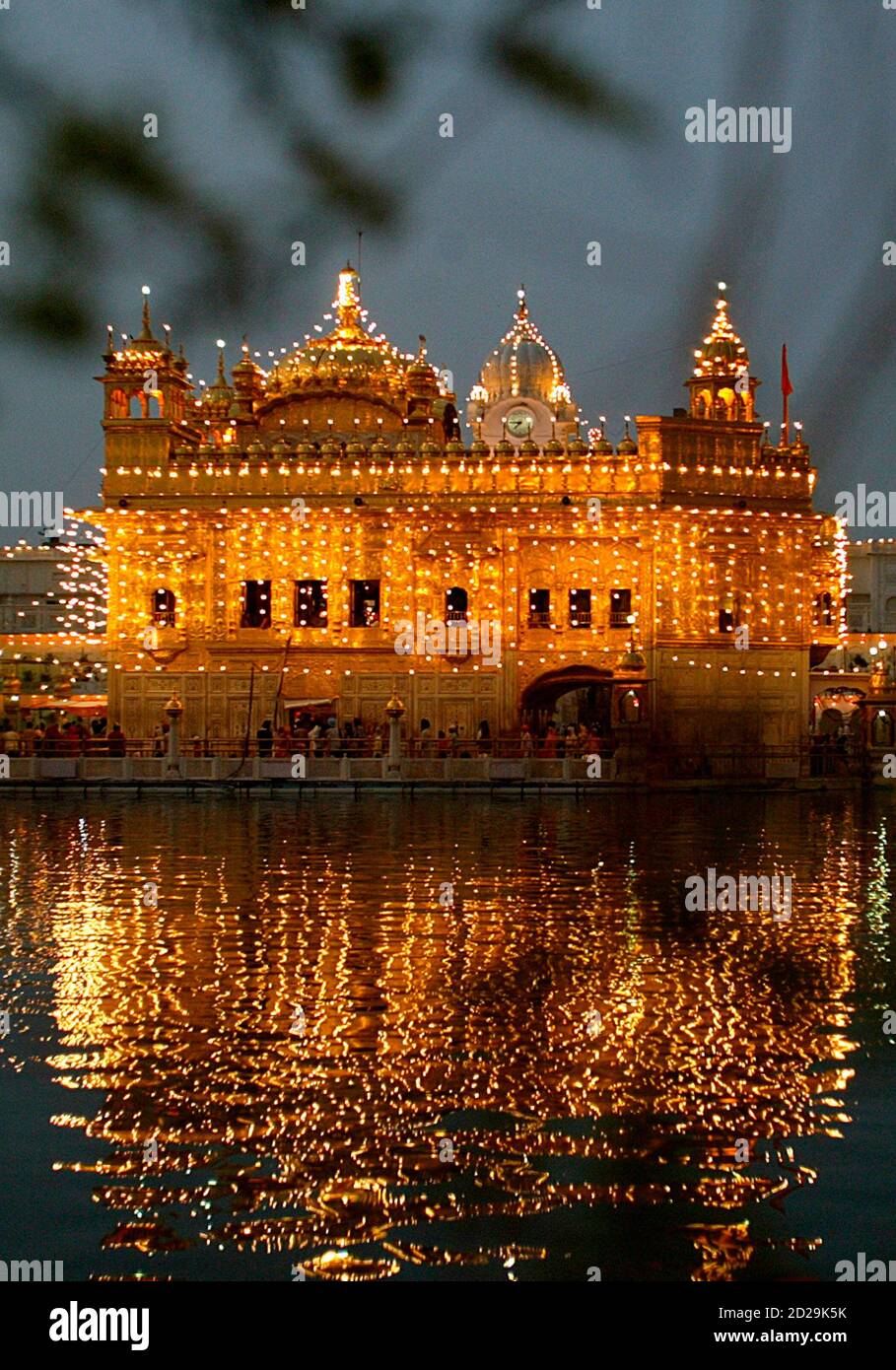 Sikh holy shrine Golden Temple is illuminated on the occasion of the 403rd anniversary of installation of Guru Granth Sahib or the holy book of Sikhism in the northern Indian city of Sikh holy shrine Golden Temple is illuminated on the occasion of the 403rd anniversary of installation of Guru Granth Sahib or the holy book of Sikhism in the northern Indian city of