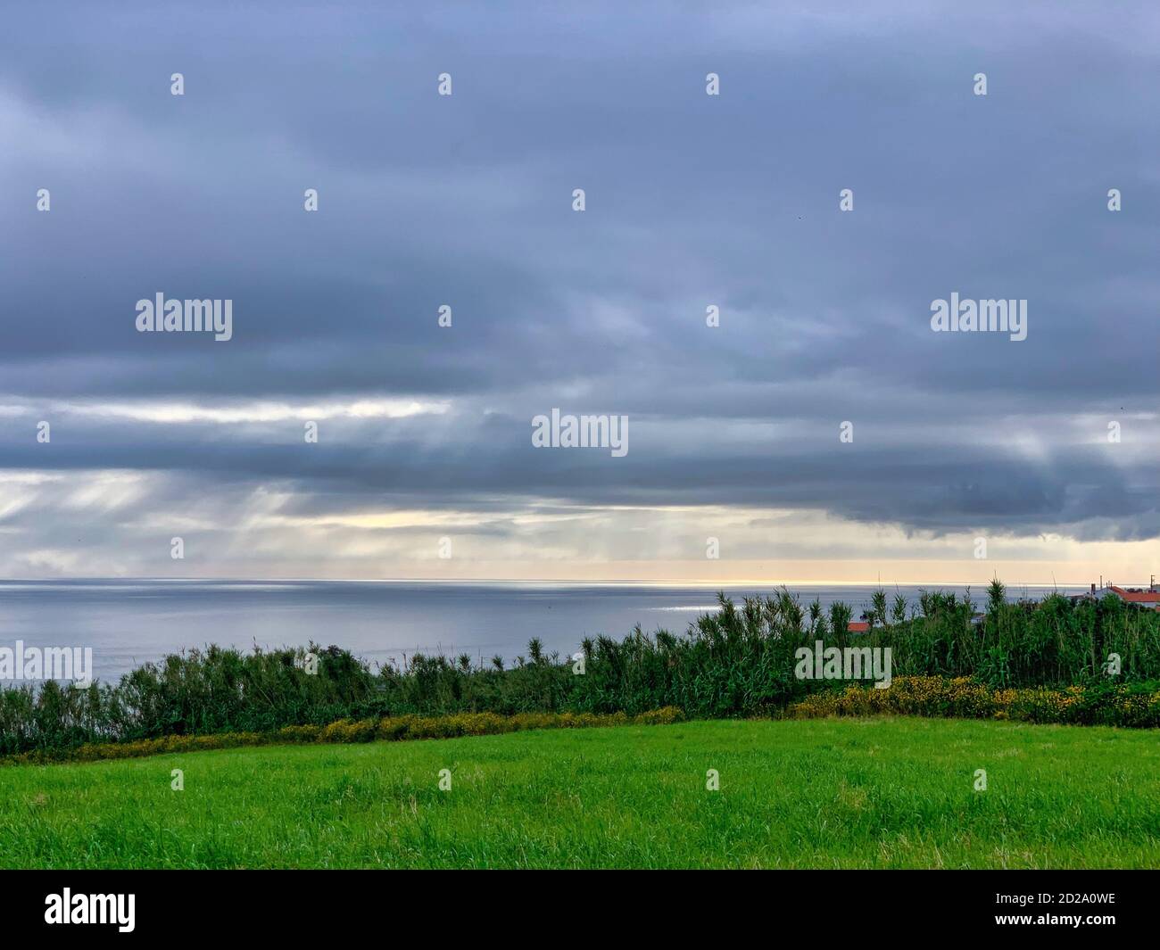Scenic landscape by the lake under a cloudy sky Stock Photo - Alamy