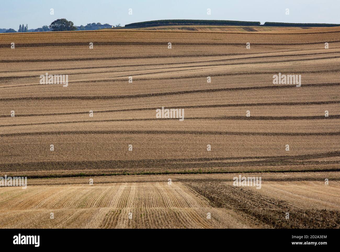 A farming landscape of gently rolling hills that are typical of The Gers region of South West France. Stock Photo