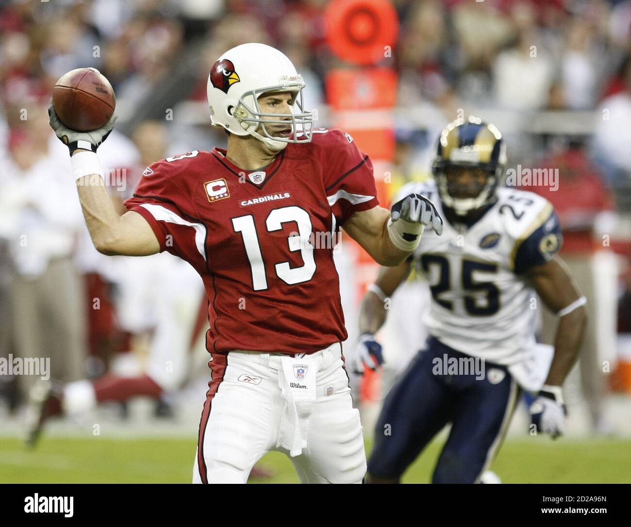 Arizona Cardinals quarterback Kurt Warner (L) throws down field against the St Louis Rams in the third quarter during an NFL game in Glendale, Arizona, December 7, 2008. The Cardinals captured the NFC West by defeating the Rams 34-10. REUTERS/Rick Scuteri (UNITED STATES) Stock Photo