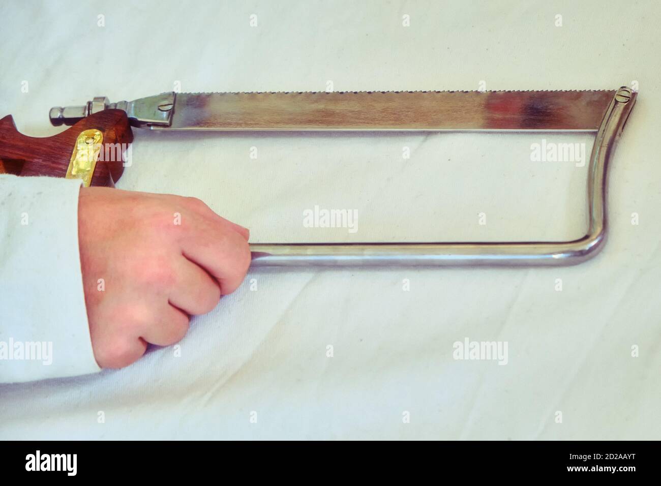 Retro saw for operations in the old days. Medical instrument for surgical amputations. Stock Photo
