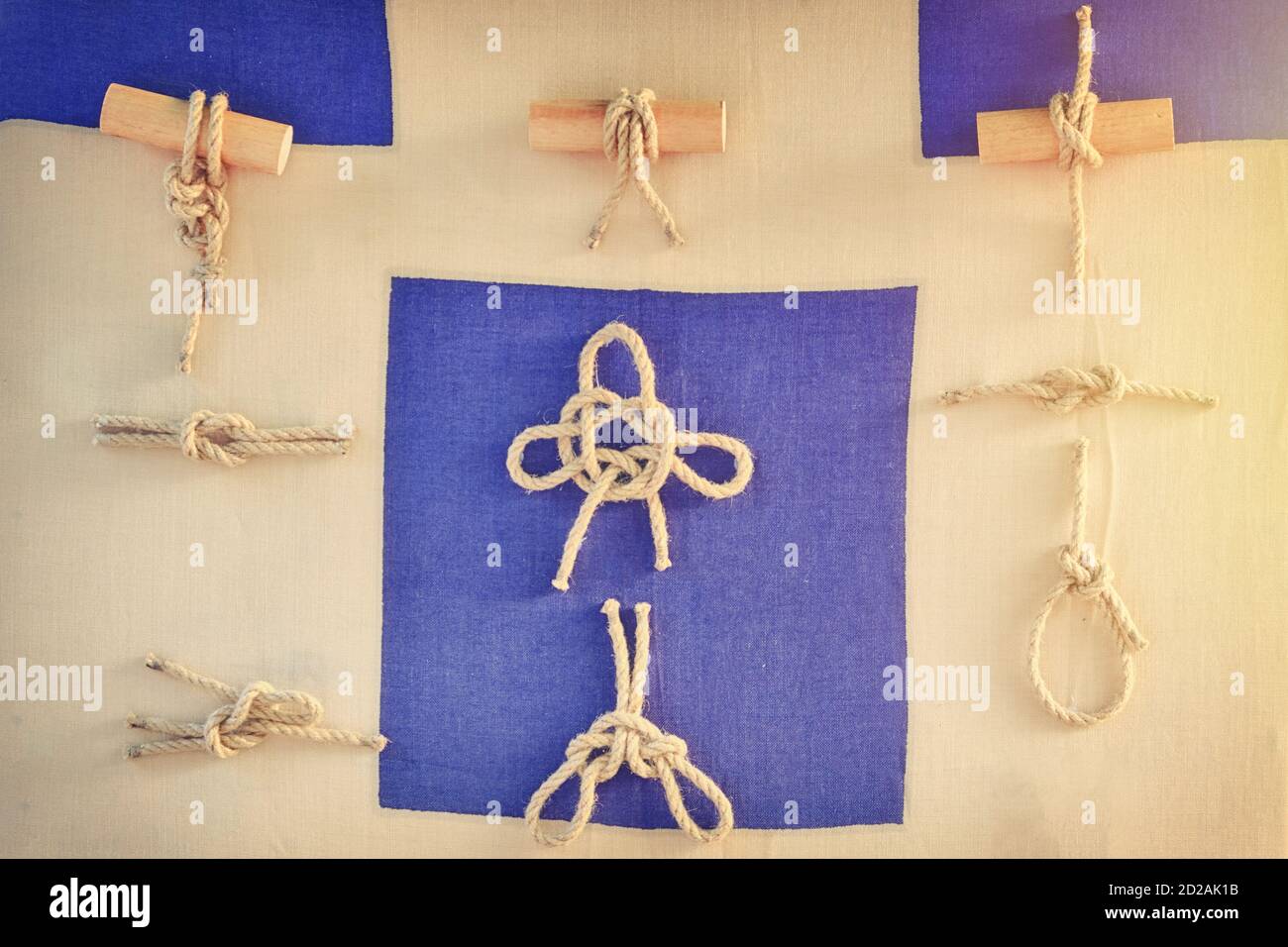 Types of sea knots for tying ropes on the ship. Examples of tying a cordage  into a knot in the Navy Stock Photo - Alamy