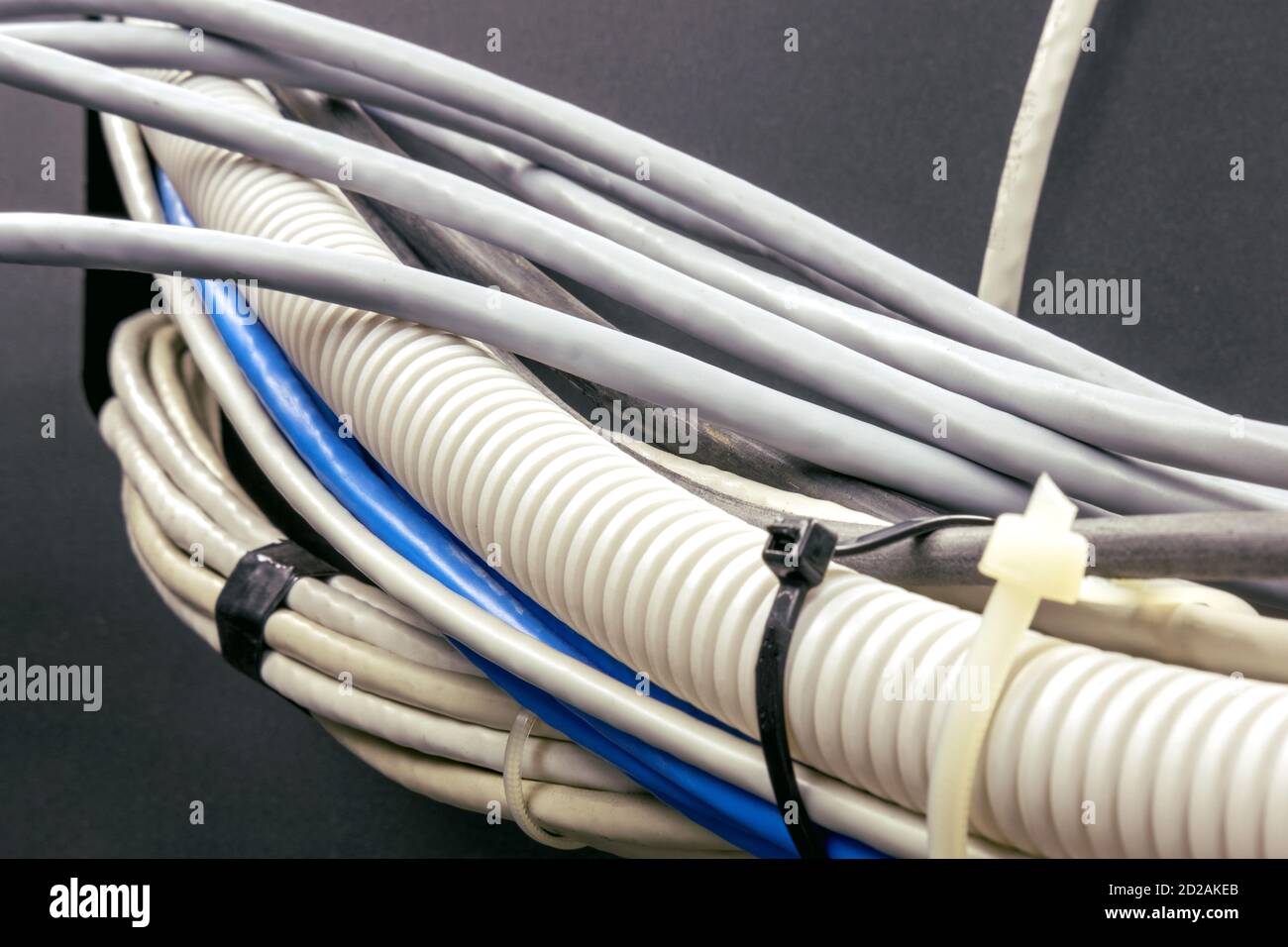 Bundle of electrical wires and network cables, close-up Stock Photo