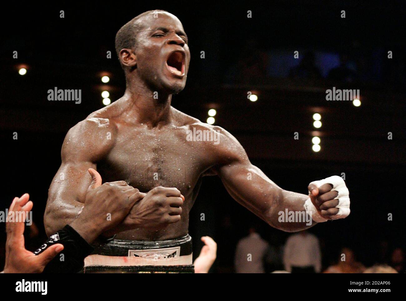 Joshua Clottey of Ghana yells after beating Zab Judah of the U.S. following their IBF welterweight title fight at the Palms Casino Resort in Las Vegas, Nevada August 2, 2008. REUTERS/Steve Marcus (UNITED STATES) Stock Photo