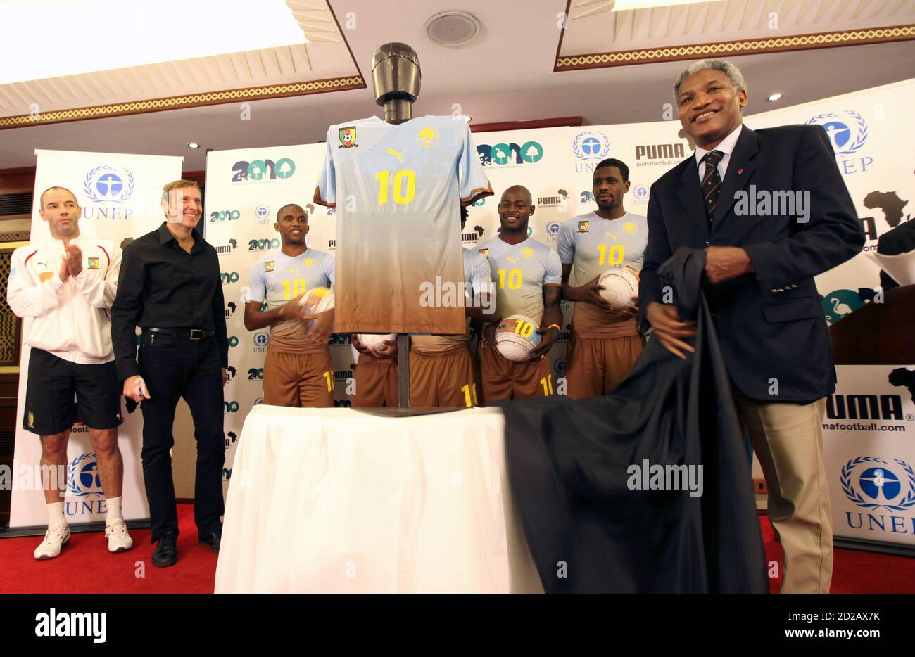 Cameroon Football Federation president Mohammed Iya (R) unveils the PUMA  Africa Unity Replica jersey in Kenya's capital Nairobi, January 6, 2010.  PUMA and the United Nations Environment Programme (UNEP) were joined by