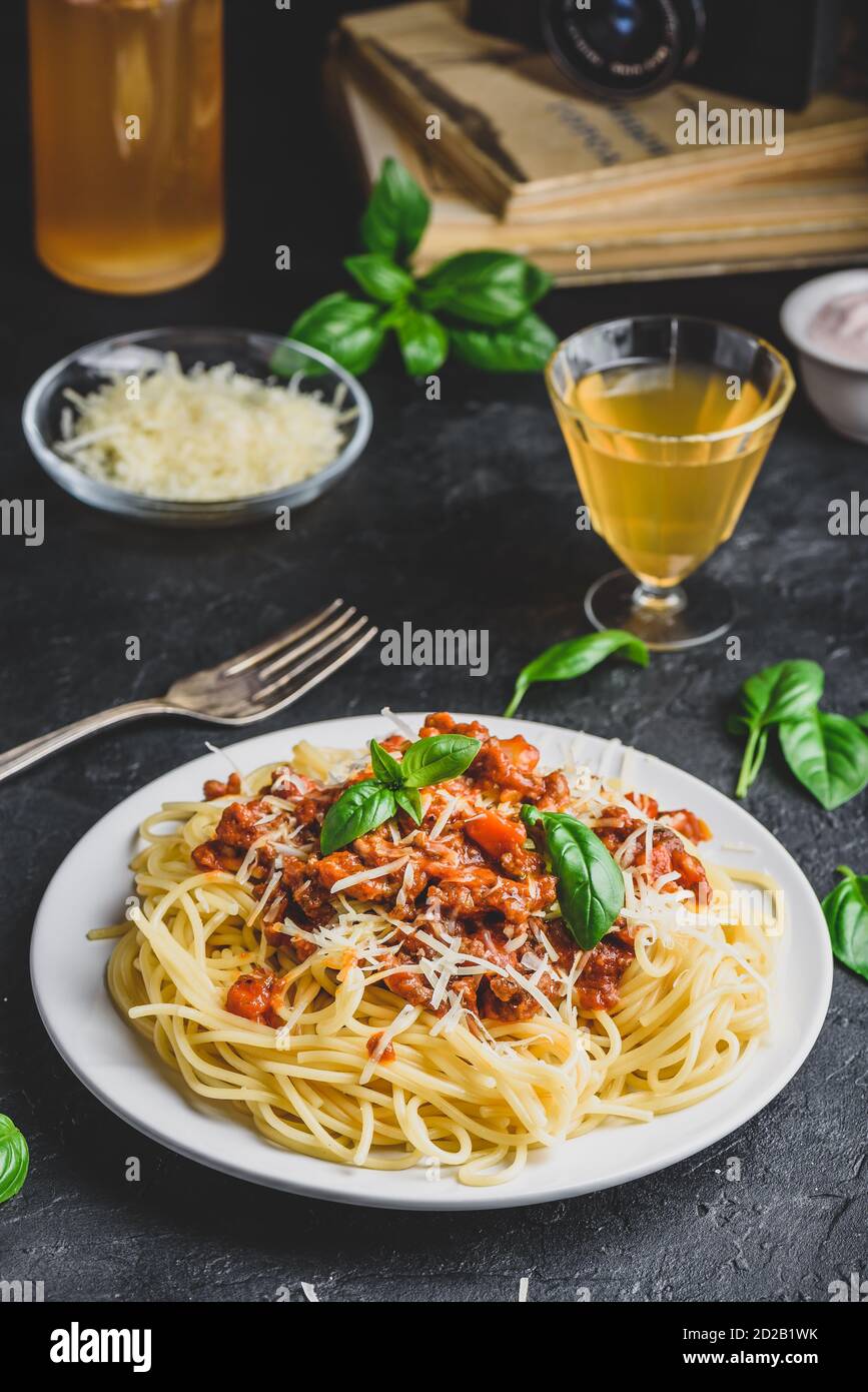 Spaghetti with bolognese sauce, parmesan and basil Stock Photo