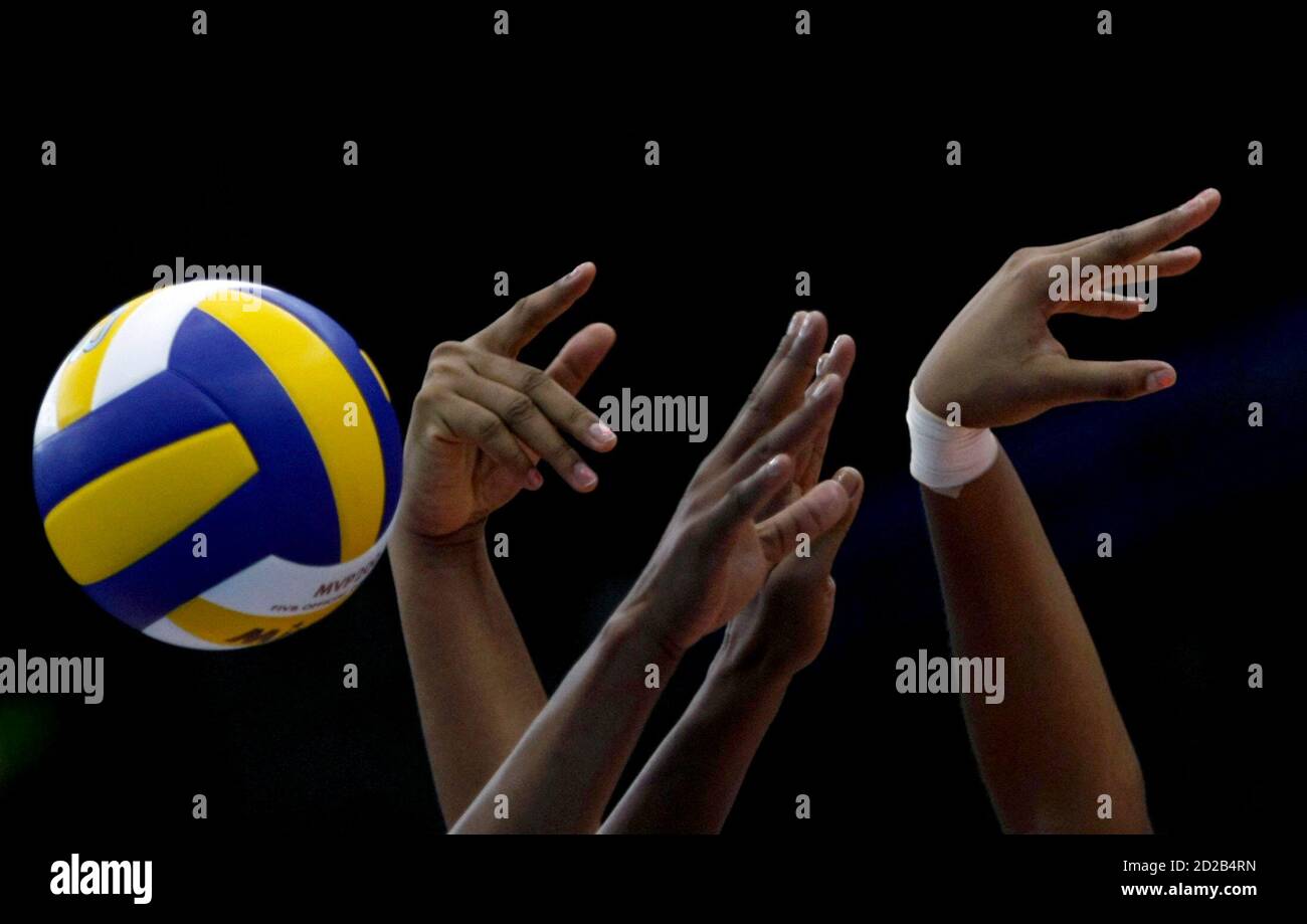 Cuba S Yanelis Santos Allegne And Nancy Carrillo De La Paz Jump To Block The Spike From
