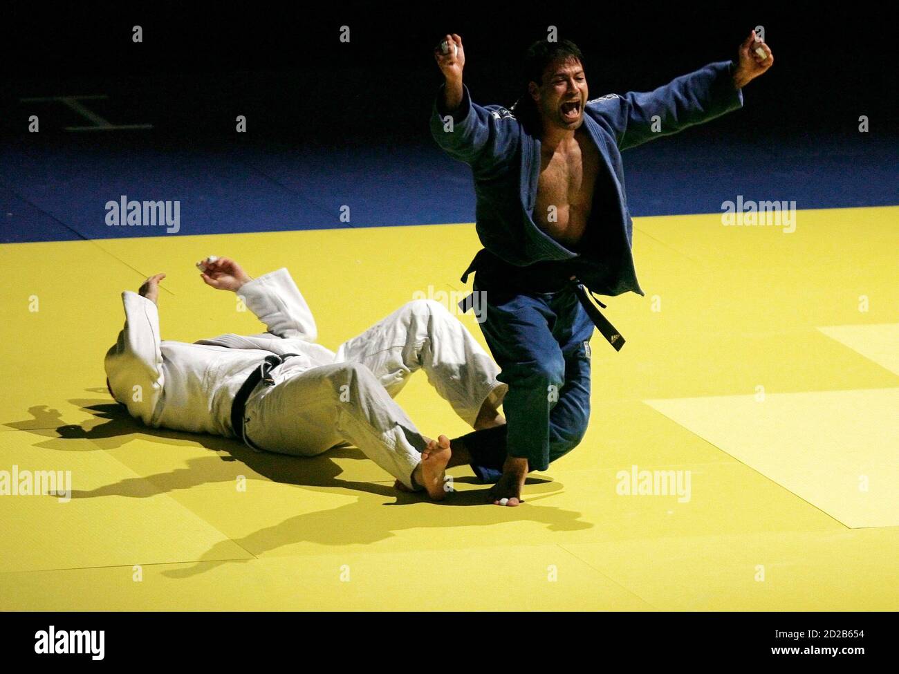 Israel's Ariel Zeevi (in blue) celebrates after winning -100 Kg bronze  medal of the European Judo Championship against France's Cristophe Humbert  in Lisbon April 13, 2008. REUTERS/Nacho Doce (PORTUGAL Stock Photo - Alamy