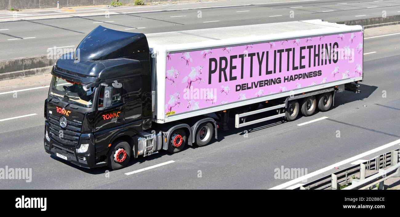Haulier lorry truck & Pretty Little Thing fashion retail business supply chain delivery trailer & pink advertising for prettylittlething motorway uk Stock Photo