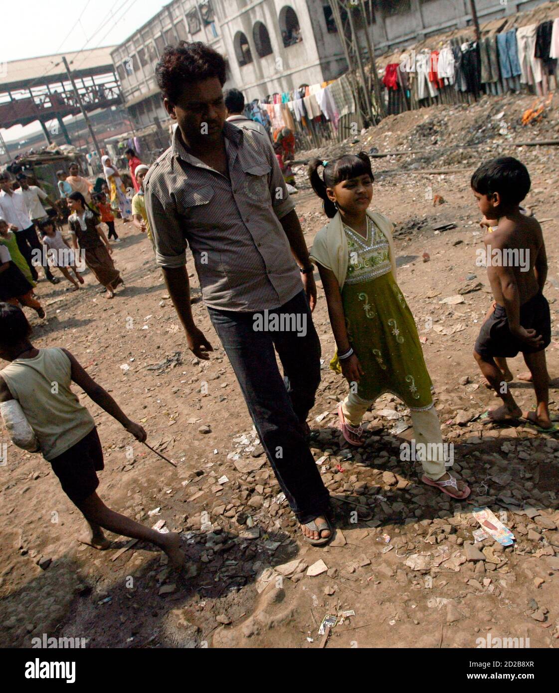 Rubina Ali 2nd R Who Acted As Young Latika In The Film Slumdog Millionaire Leaves Her Home At A Slum With Her Father Rafiq Qureshi To Get Her Passport And U S Visa