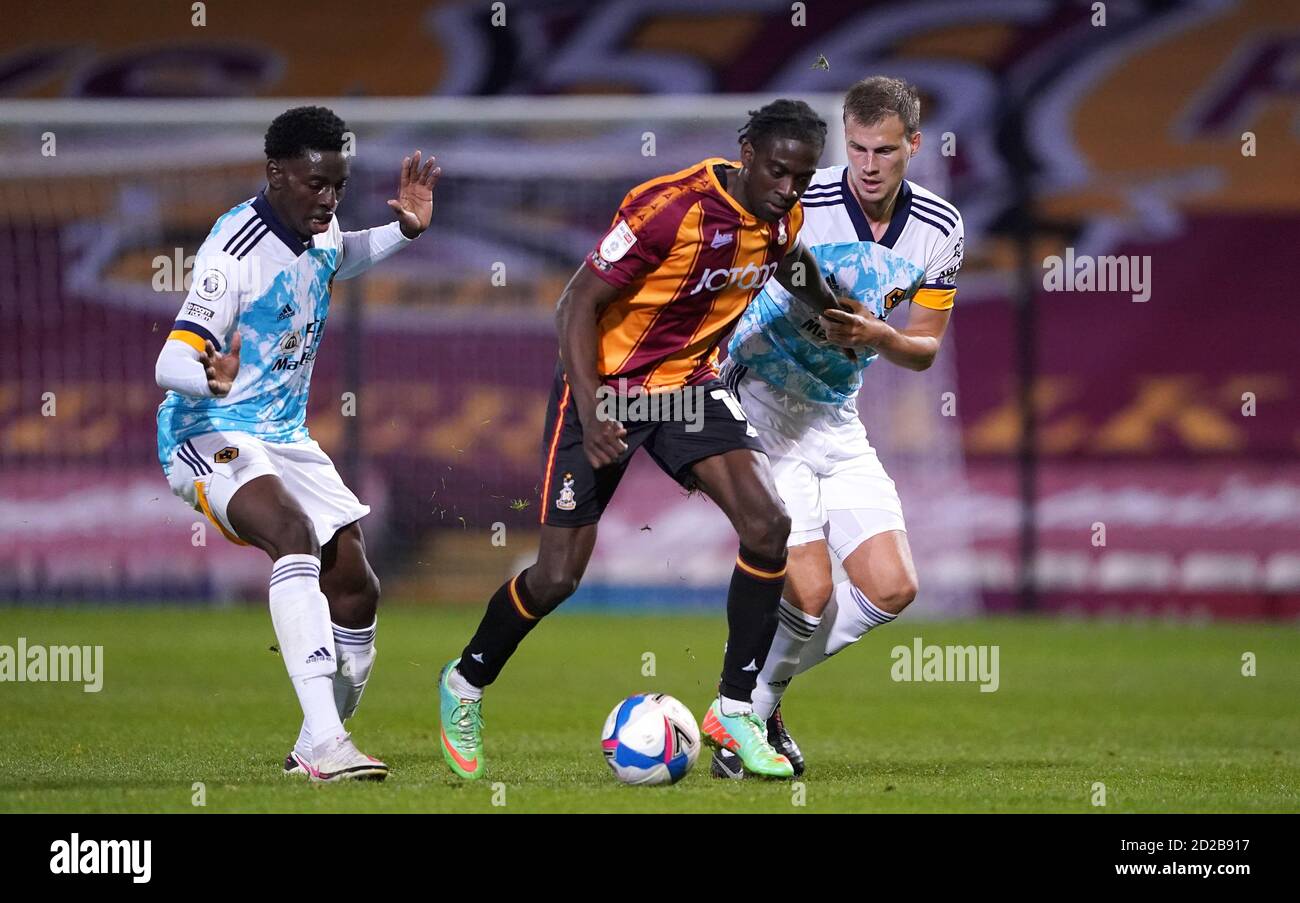 Bradford City's Clayton Donaldson (centre) and Wolverhampton Wanderers' Ryan Bennett (left) and Owen Otasowie battle for the ball during the EFL Trophy match at the Utilita Energy Stadium, Bradford. Stock Photo