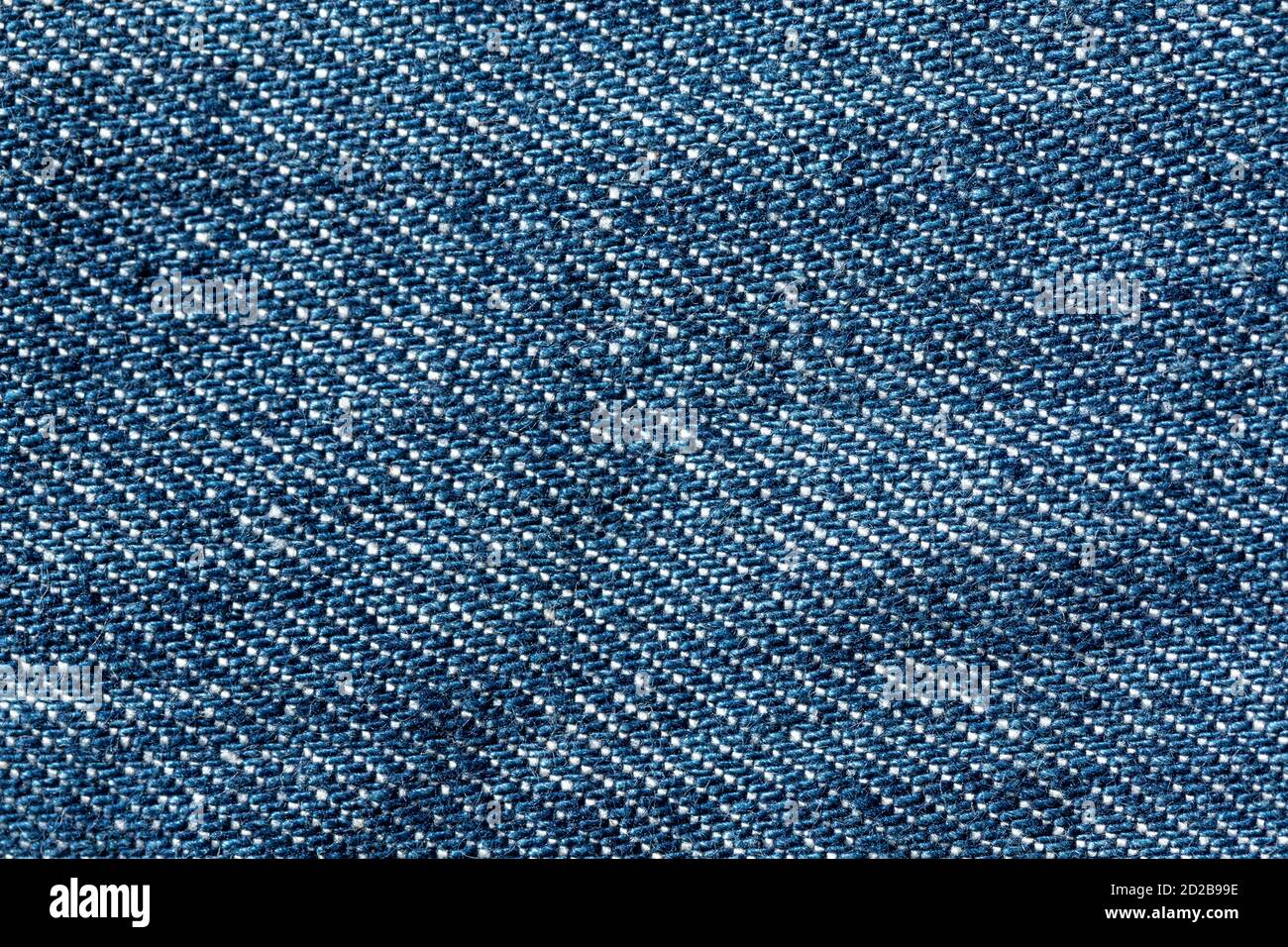 Abstract blue jeans fabric texture and background. Detail of jean