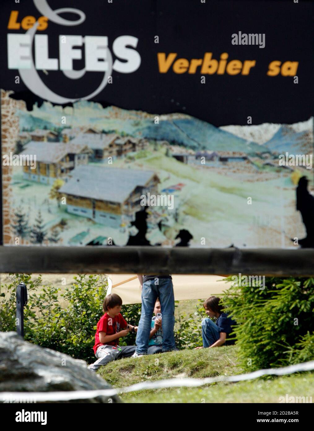 Unidentified students play outside "Les Elfes" International shcool in  Verbier July 13, 2009. Fourteen of the hundred and twenty students at the  school have been diagnosed with A flu (H1N1) and the