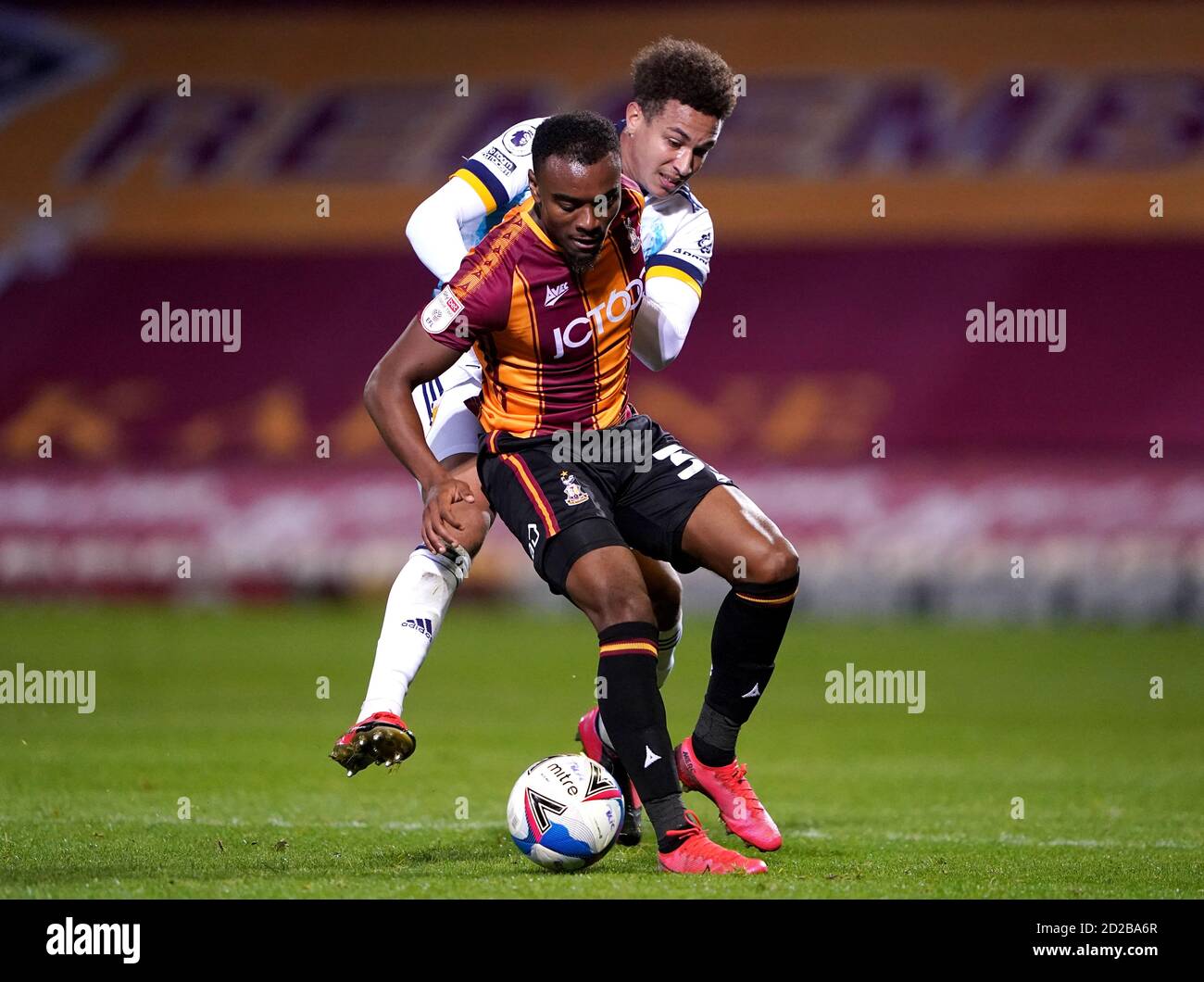 Bradford City's Dylan Mottley-Henry (front) and Wolverhampton Wanderers' Lewis Richards battle for the ball during the EFL Trophy match at the Utilita Energy Stadium, Bradford. Stock Photo