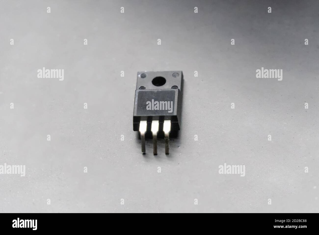 Power transistor close up on black background with copy space Stock