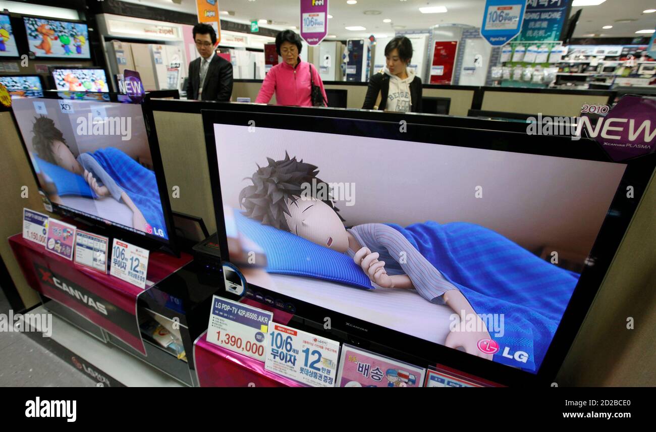 People look at LG Electronics television sets displayed at a shop in Seoul  April 28, 2010. World No.2 TV maker LG Electronics said it aims to turn  around its struggling mobile division