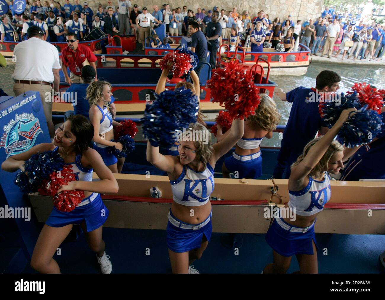 Kansas cheerleaders dance on a boat before the start of the NCAA men's  Final Four championship basketball game against Memphis in San Antonio,  Texas April 7, 2008. REUTERS/Jessica Rinaldi (UNITED STATES Stock