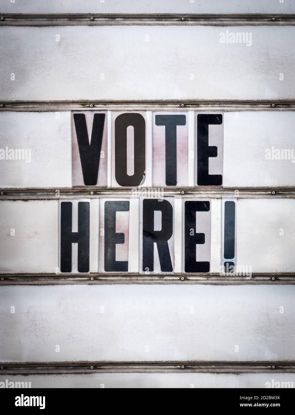 A Retro Sign Used To Say Vote Here Outside A Polling Place For The 2020 US Presidential Election Stock Photo