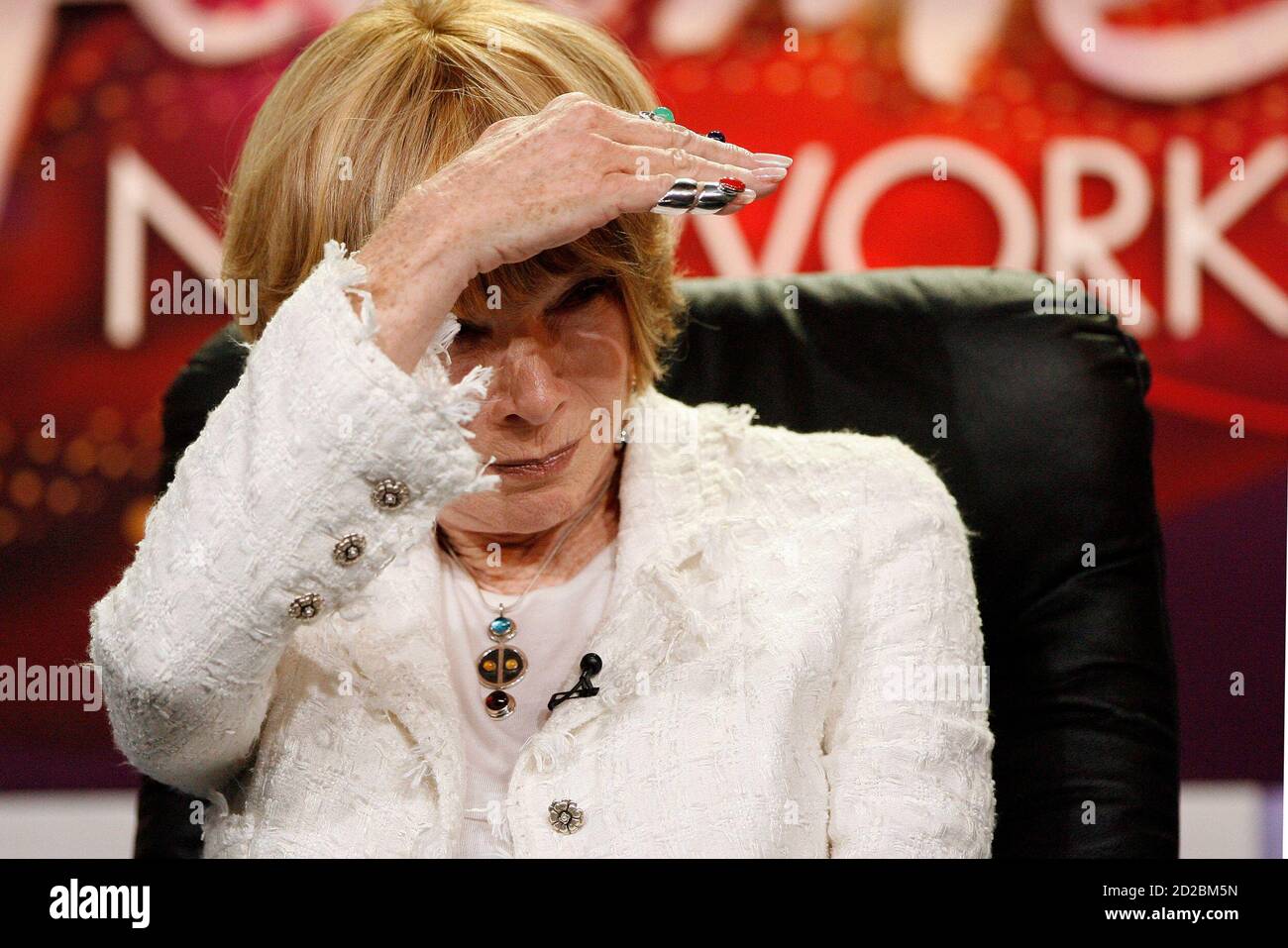Actress Shirley MacLaine shades her eyes during a panel for the Lifetime  Networks movie "Coco Chanel" at the Television Critics Association 2008  summer press tour in Beverly Hills, California July 11, 2008.