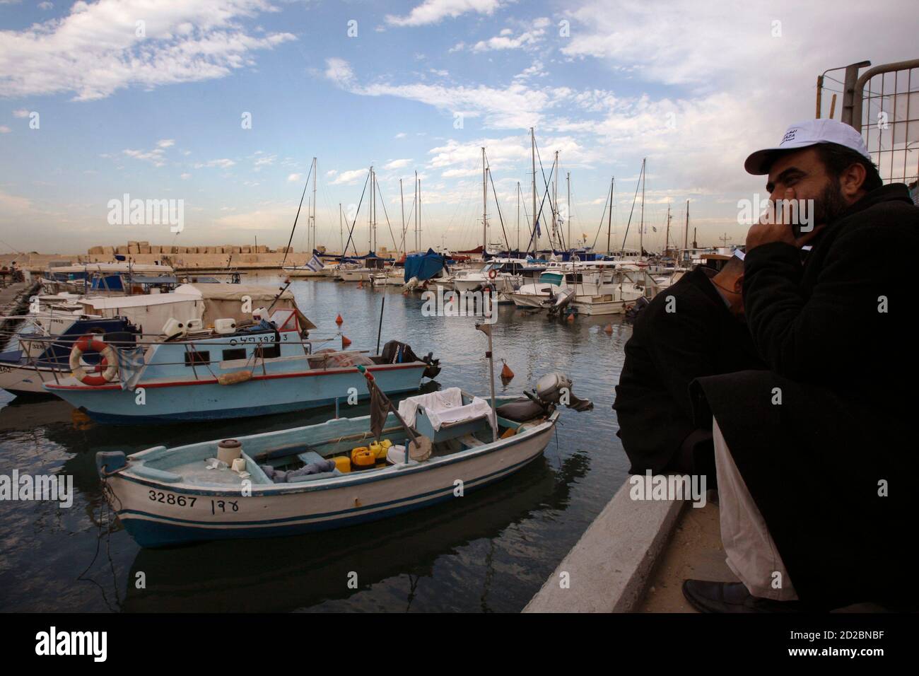 An Israeli Arab sits in the front of the Jaffa port near Tel Aviv, December 7, 2008. Israeli police on Sunday foiled an attempt by Israeli Arabs to set off in a boat from Israel to the Hamas-controlled Gaza Strip with a cargo of food and medical supplies. Israel's blockade of the Gaza Strip has been stepped up in recent weeks amid a surge of violence along its frontier with the Palestinian territory. REUTERS/Gil Cohen Magen (ISRAEL) Stock Photo