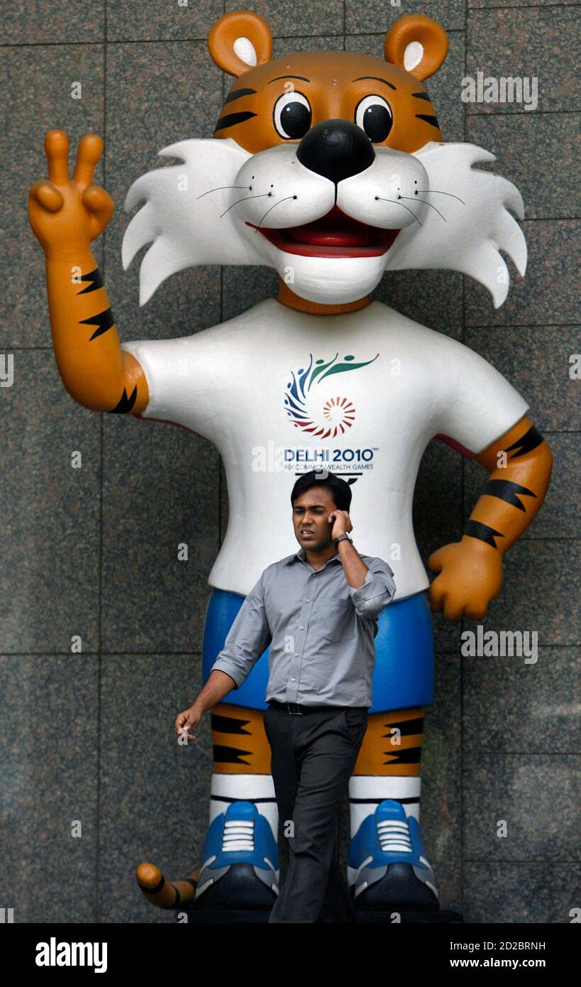 A commuter walks past the New Delhi Commonwealth Games 2010 mascot in New  Delhi October 3, 2009. The head of the Commonwealth Games Federation (CGF)  believes there are "enormous" challenges facing the