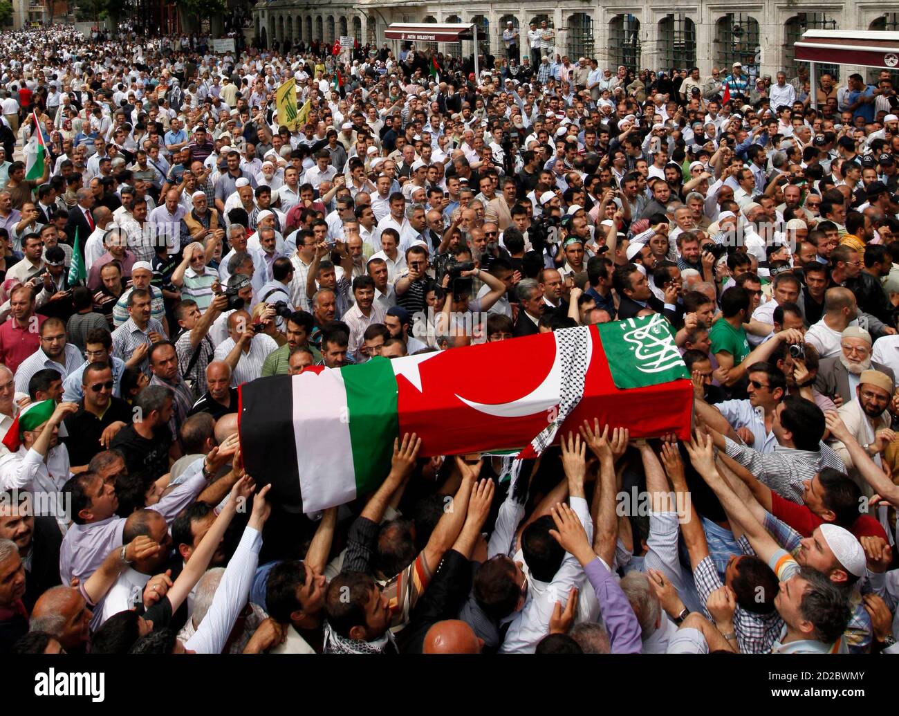 The Turkish And Palestinian Flags Wrapped Coffin Of An Activist Who Was Killed When Israel Seized A Turkish Aid Ship Bound For Gaza Is Carried By Relatives And Friends During A Funeral Ceremony<script async src=