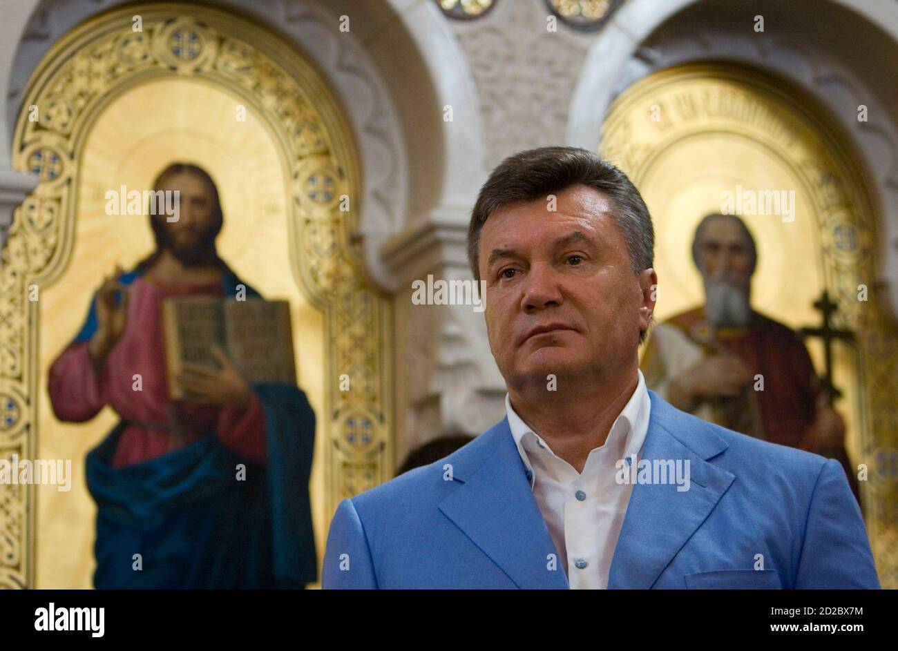 Ukraine's President Viktor Yanukovich attends a religious service marking his country's adoption of Christianity, in the town of Khersones, July 28, 2010. Ukraine and Russia today marked their official adoption of Christianity, which took place in Kiev, the capital of Kyivan Rus', by its grand prince Vladimir I in 988.  REUTERS/Mykhailo Markiv/Pool  (UKRAINE - Tags: HEADSHOT ANNIVERSARY POLITICS RELIGION) Stock Photo