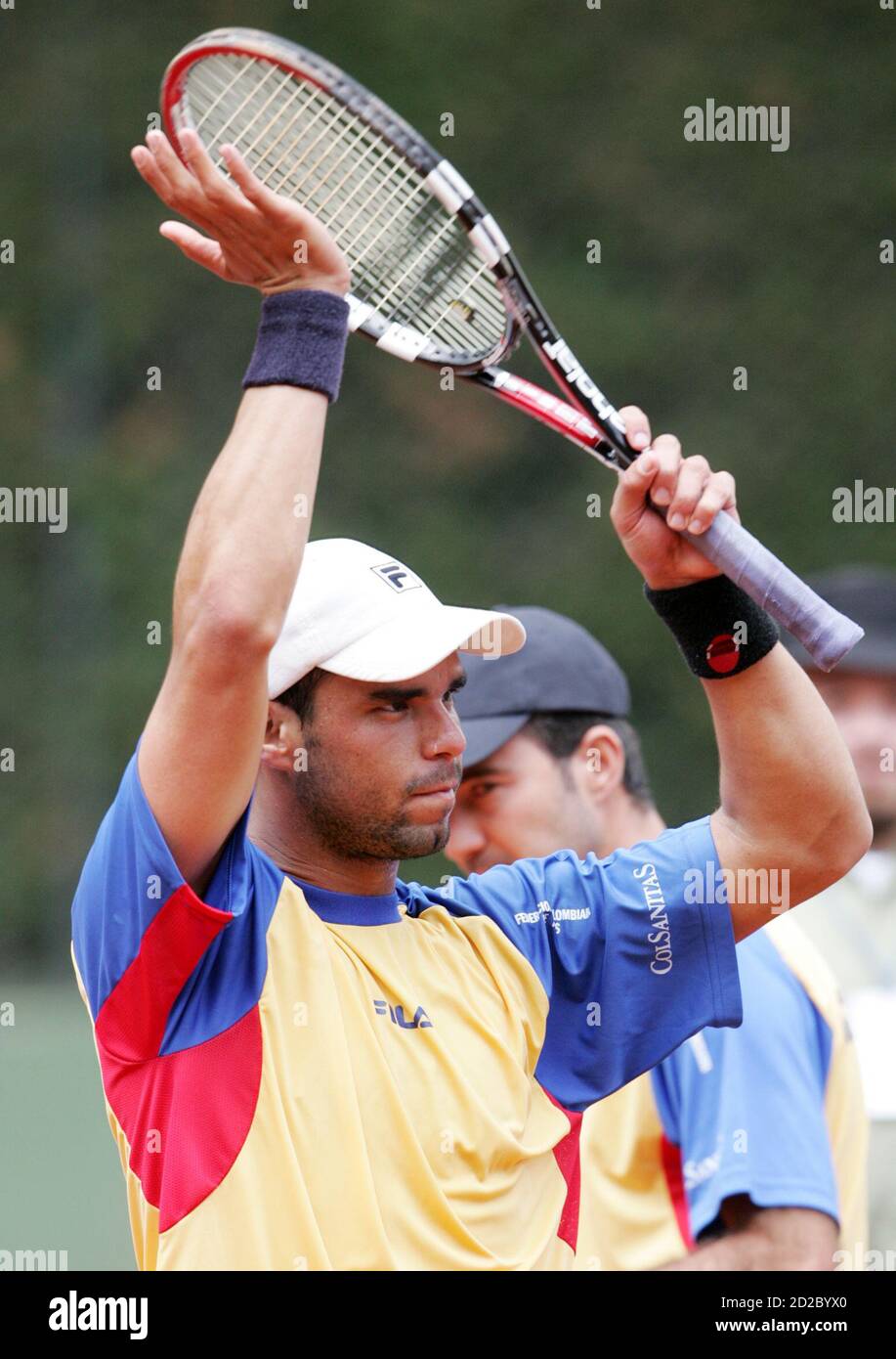 Alejandro Falla of Colombia celebrates after defeating Francisco Rodriguez  of Paraguay during their Davis Cup tennis tournament match in Bogota April  9, 2006. REUTERS/Daniel Munoz Stock Photo - Alamy